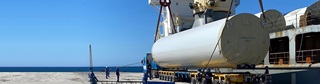 Work-In-Progress: Wind farm tower being unloaded as completion of ACEN’s Pagudpud Wind Farm development comes in full swing.